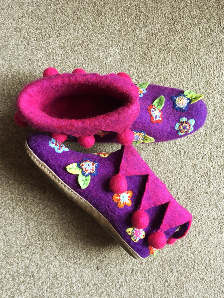 Embroidered felt flowers sown onto felt slippers