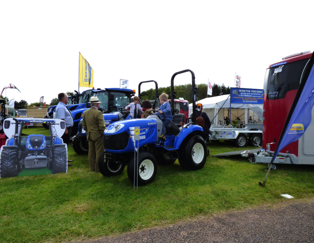 Boys playing on tractors