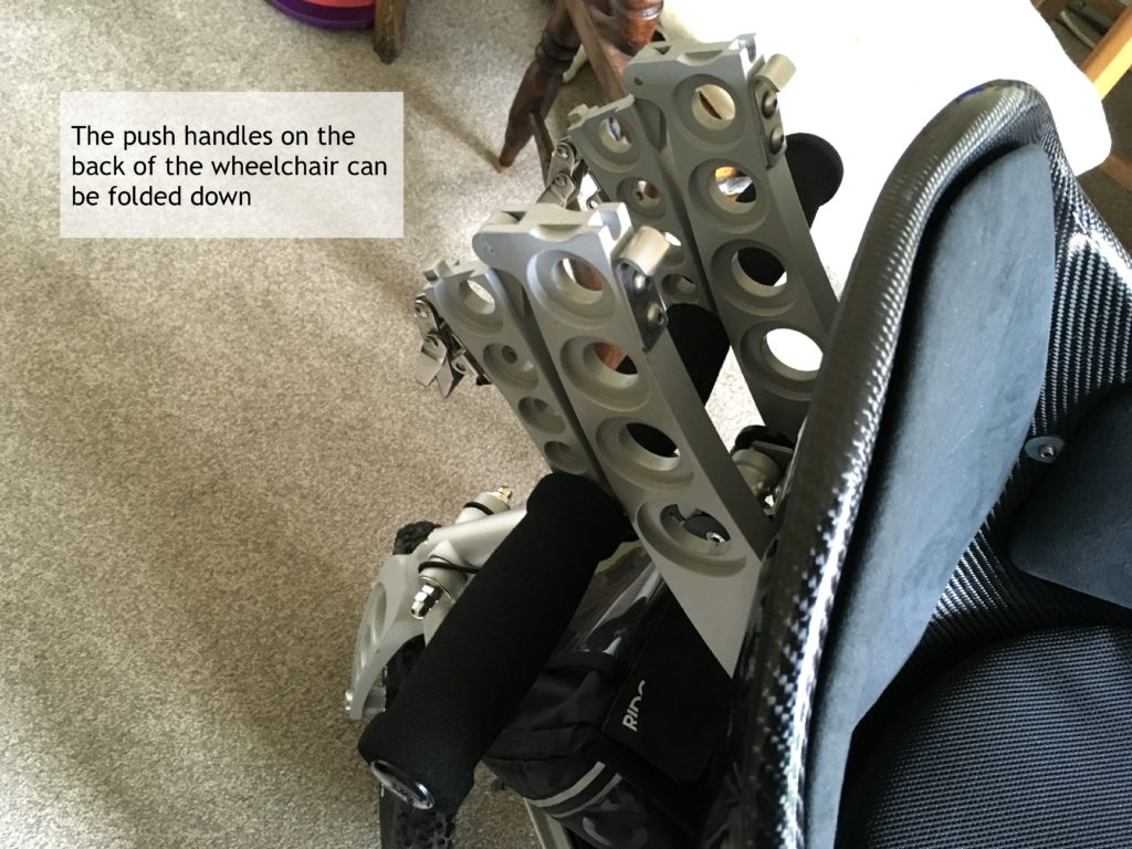 Folded push handles on Trekinetic wheelchair