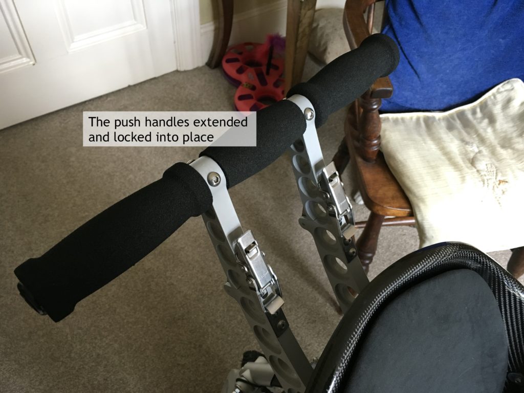 Push handles on Trekinetic wheelchair, extended