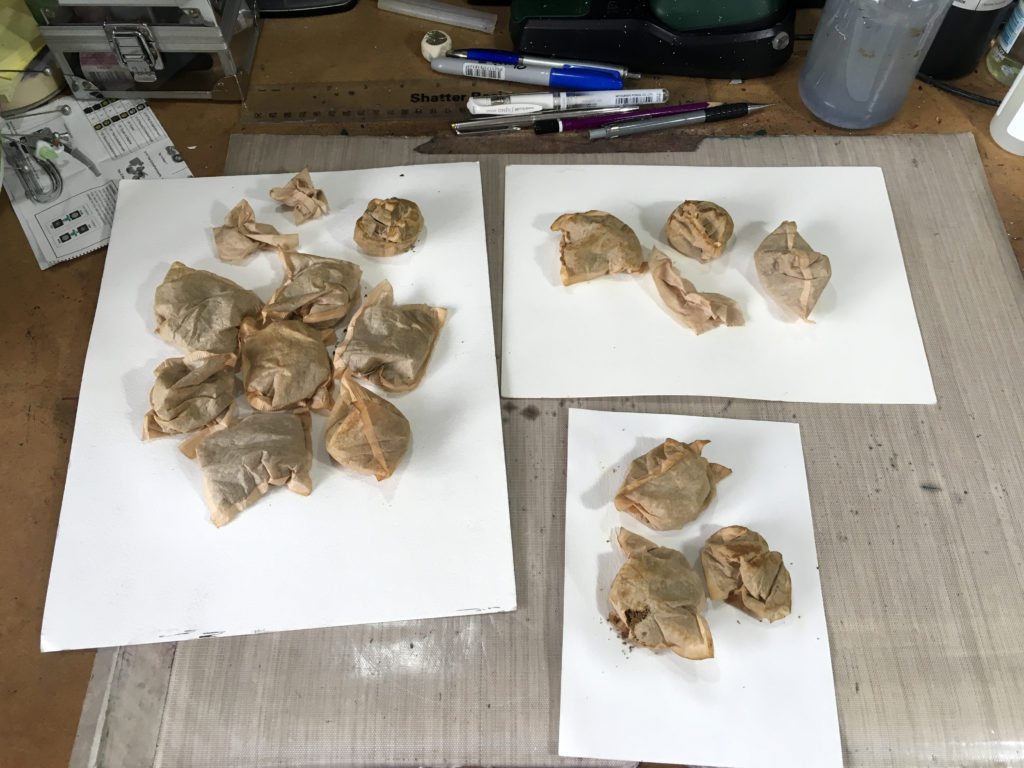 Teabags drying on watercolour paper