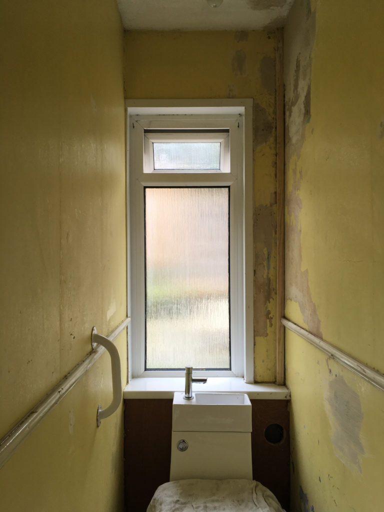 Downstair loo wallpaper stripped and plaster repaired