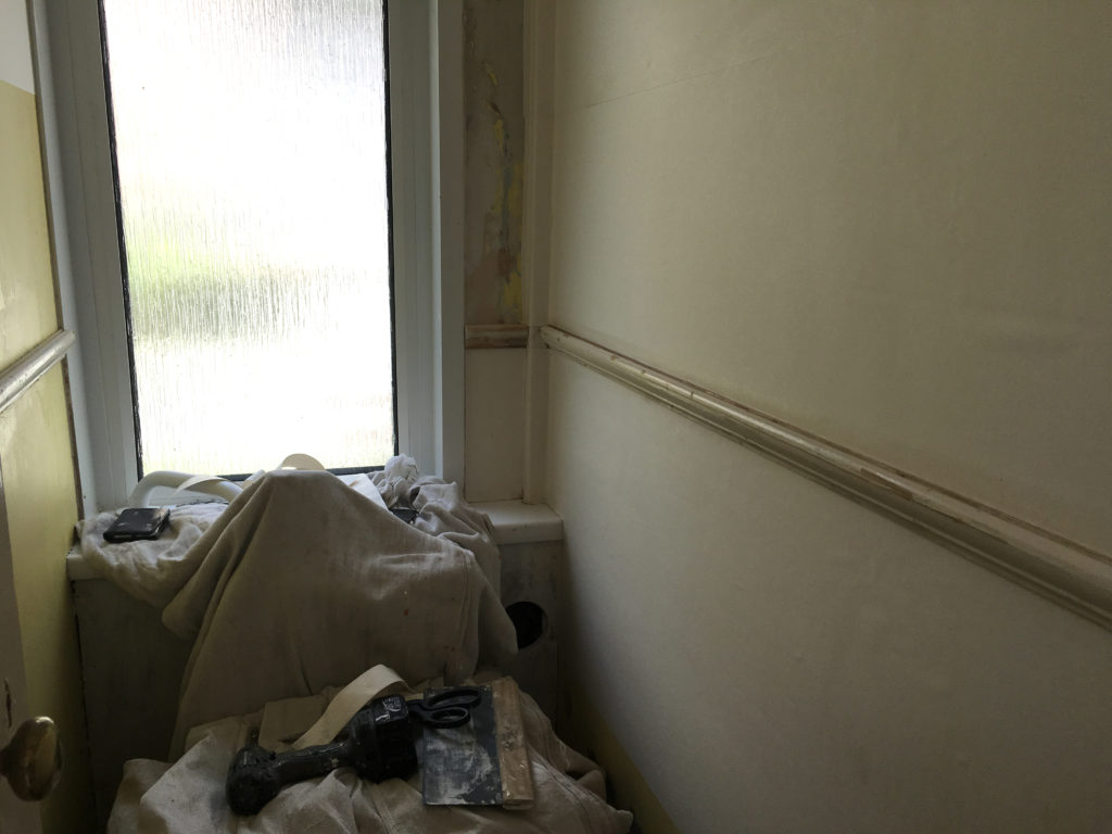 Progress on lining paper in downstairs loo