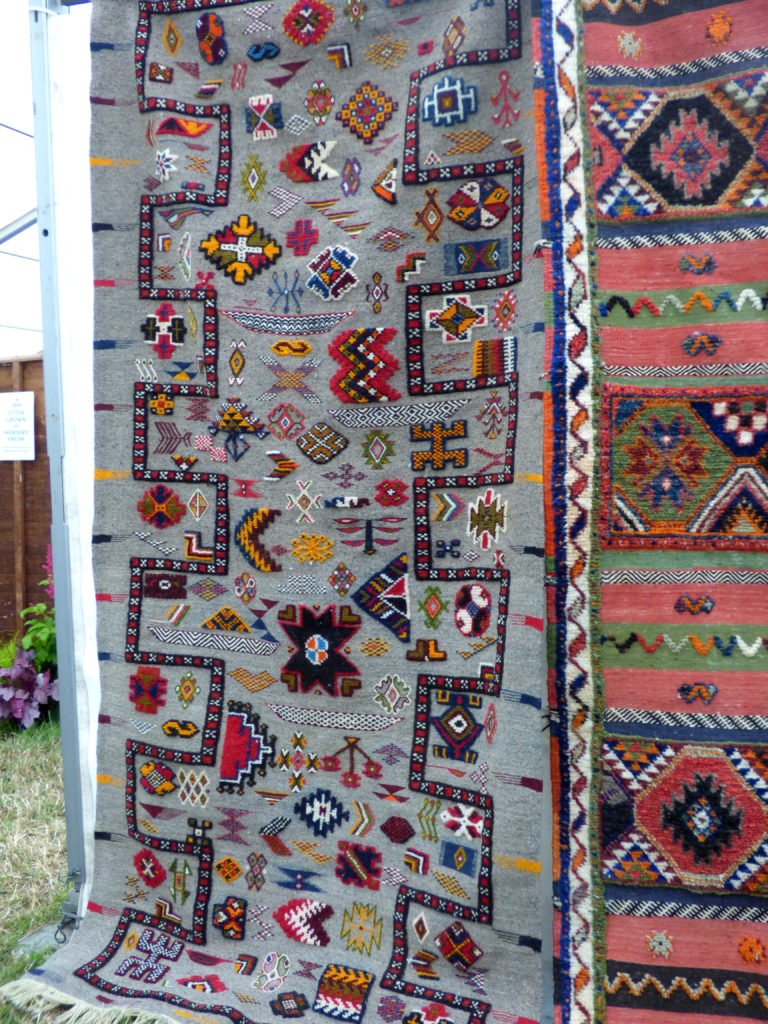 Totnes Show 2019. Woven rug with motifs.
