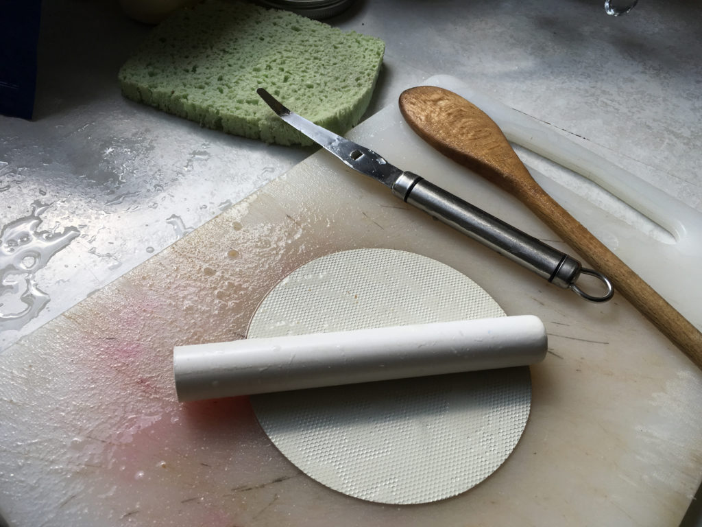 Rubber jar opener to push apple corer through