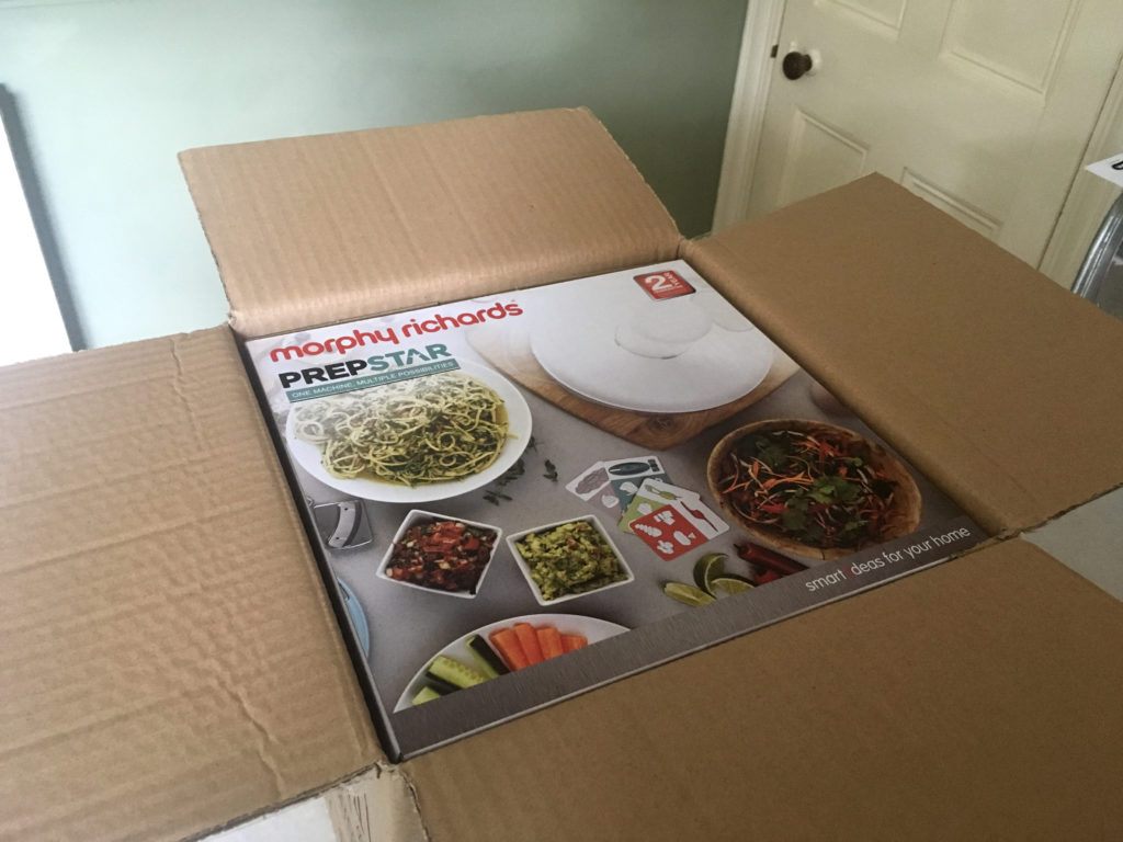 Unboxing new food processor - opening outer box.