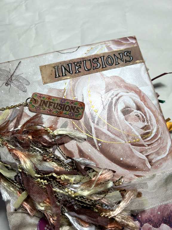 Read more about the article Infusions Mini-Album – The Spine Embellishment and Completion of the Project